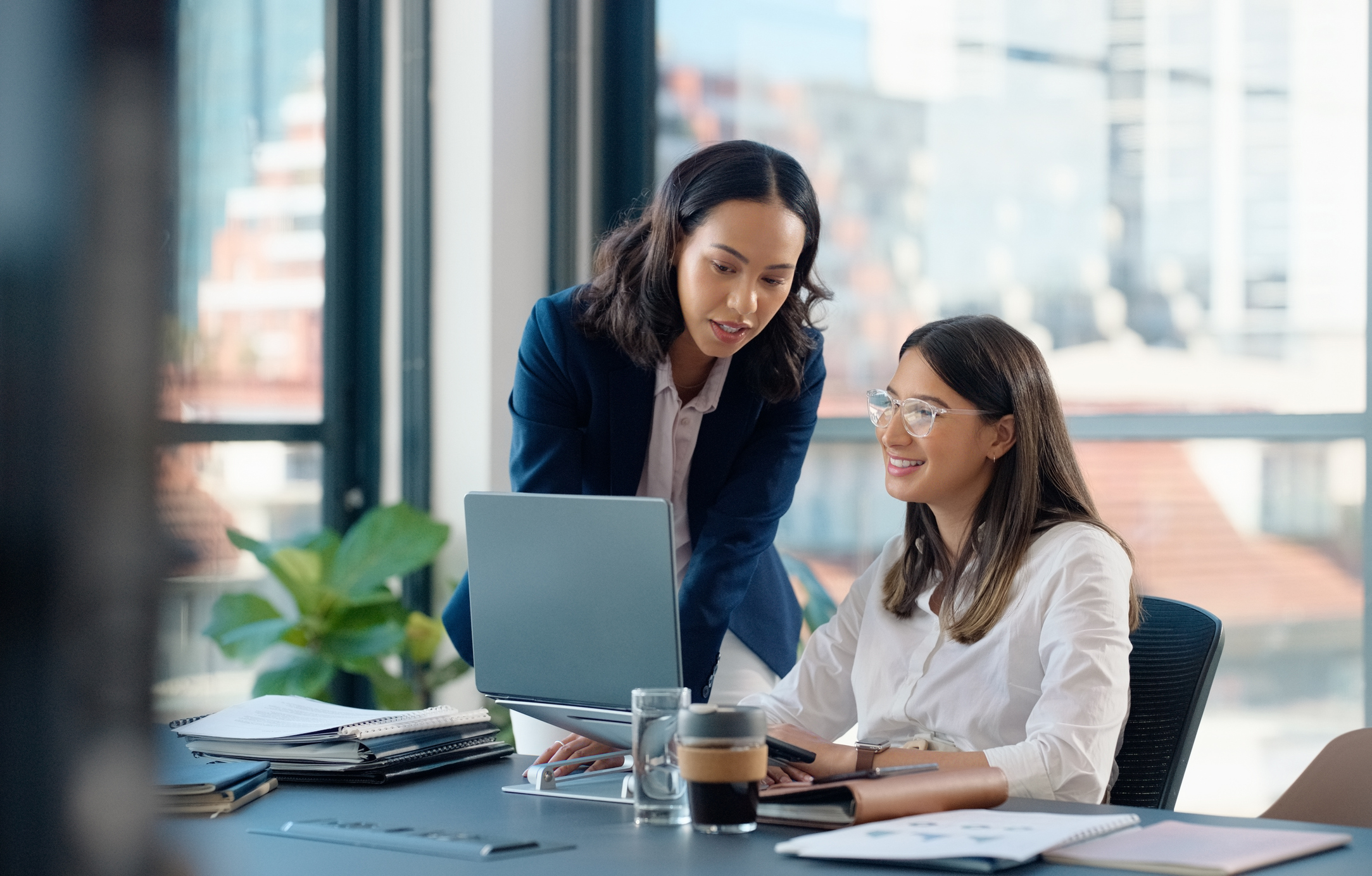 ALT Text: Business people, laptop or learning in training in discussion or conversation for news, education or advice.